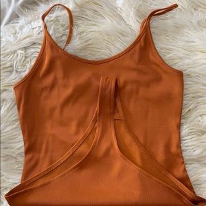 Rust  color bodysuit. Super cute